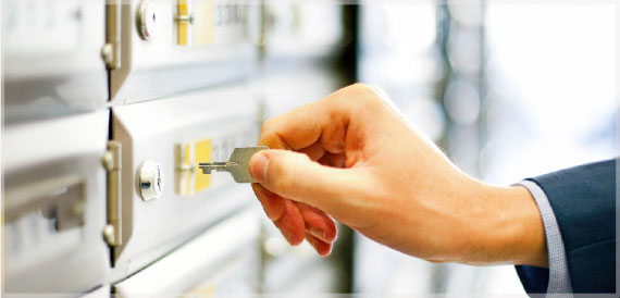 Person unlocking a safety deposit box