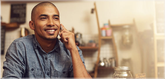 Young man talking to his bank on the phone