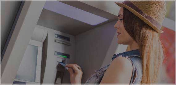 Woman using ATM