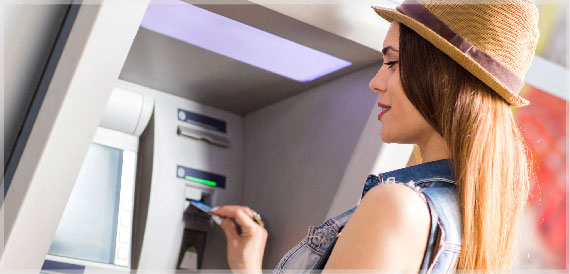 Woman using ATM